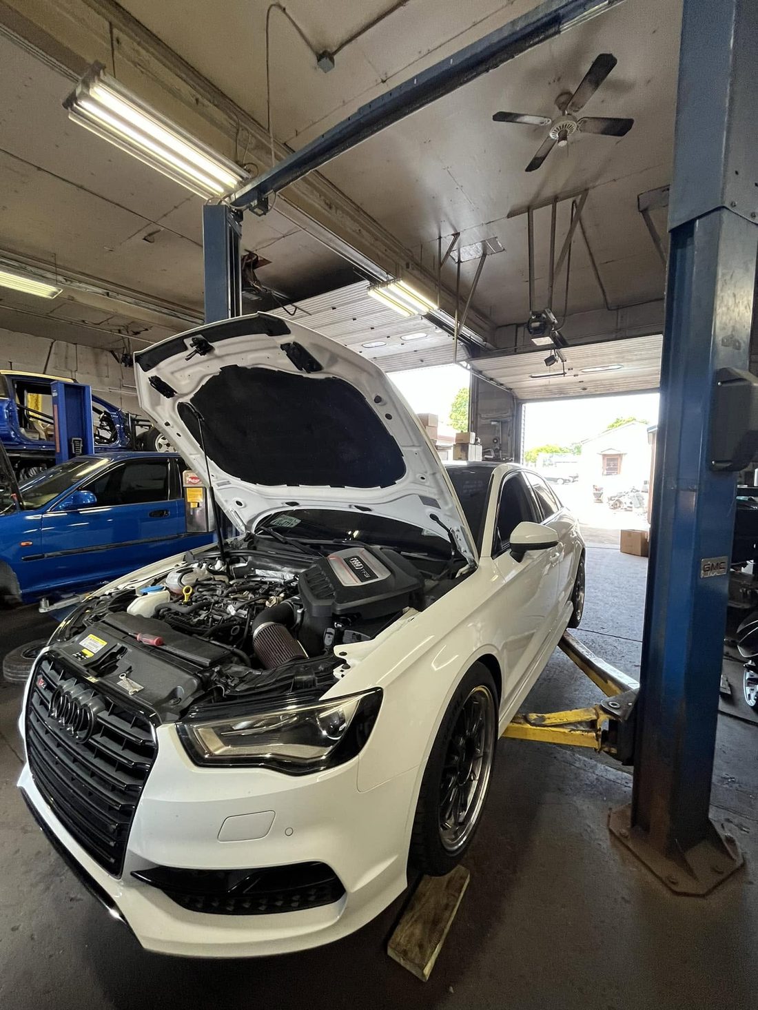 White Audi S3 on the lift for service